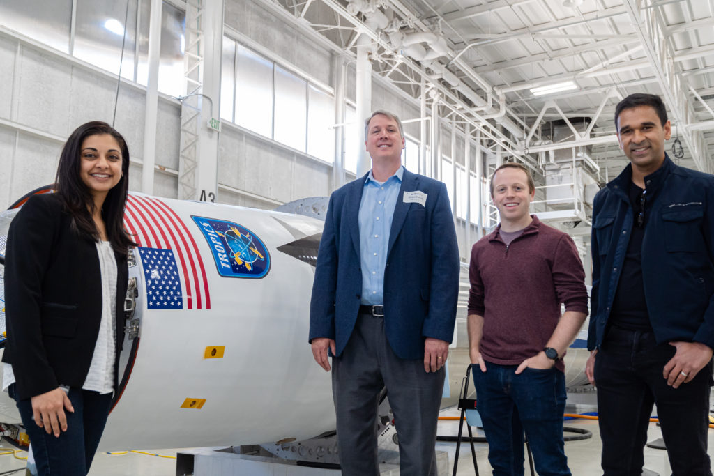 Astra Staff With Dr.blackwell Standing In Front Of One Of Astra's Rockets.